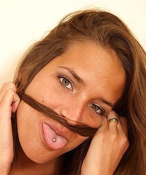 Long-legged brunette spreading her pussy lips close to the cam